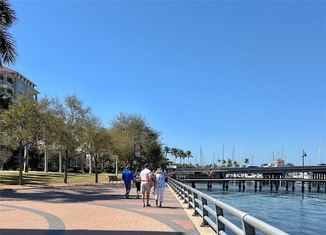 surrounding community featuring a water view