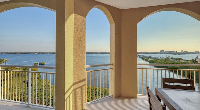 balcony at dusk with a water view