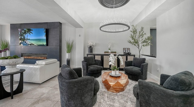 living room with baseboards and a large fireplace