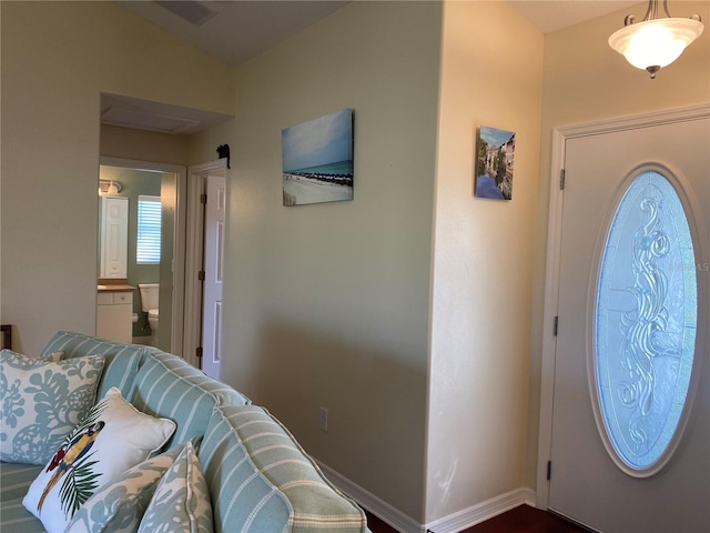 foyer entrance featuring vaulted ceiling