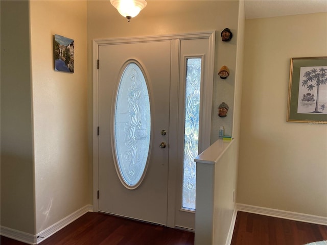 entrance foyer featuring dark hardwood / wood-style floors