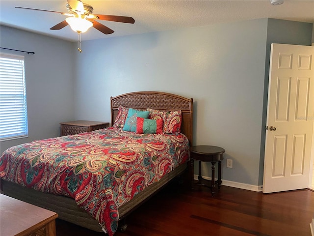 bedroom featuring dark hardwood / wood-style floors and ceiling fan