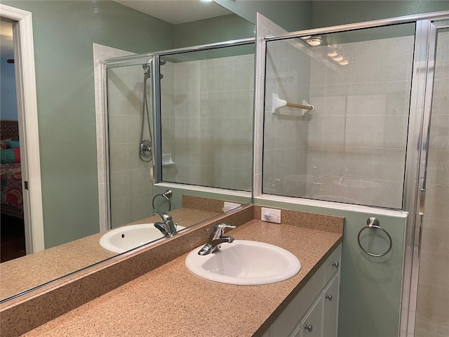 bathroom with an enclosed shower and oversized vanity