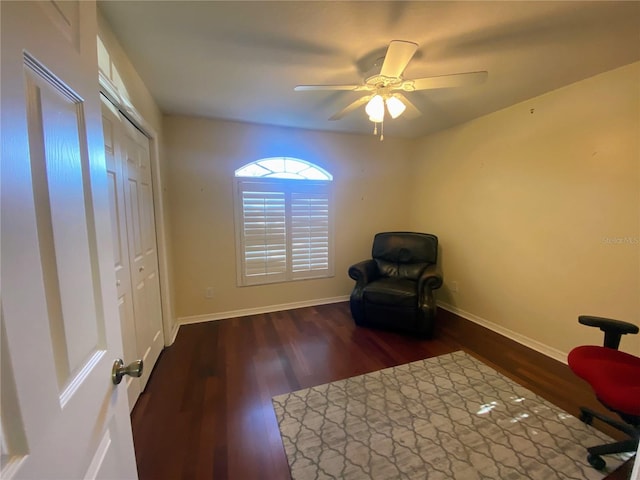 unfurnished room with ceiling fan and dark wood-type flooring