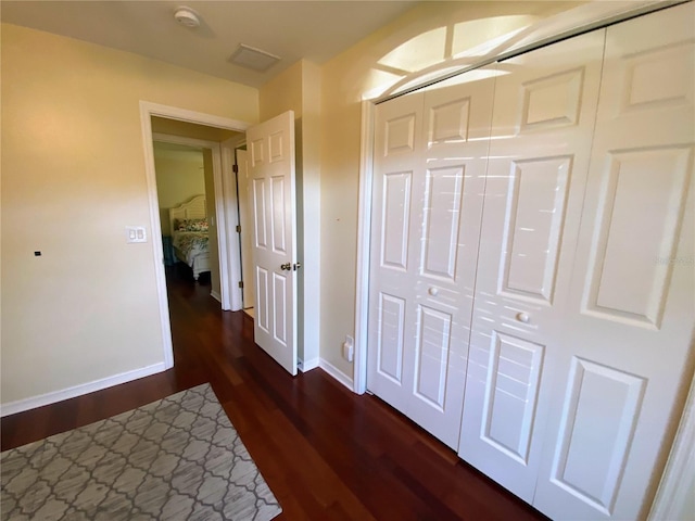 hall featuring dark wood-type flooring