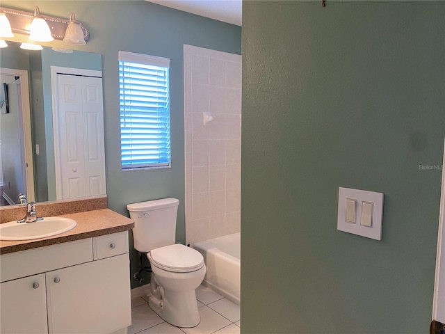 full bathroom with tiled shower / bath combo, toilet, large vanity, and tile flooring