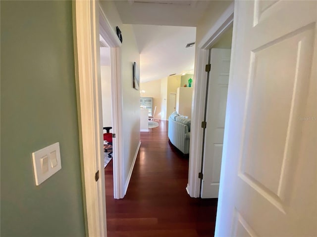 hallway featuring dark hardwood / wood-style flooring