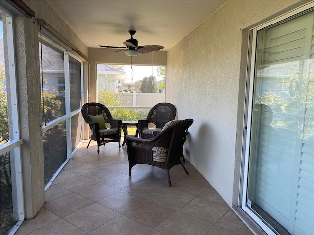 sunroom / solarium with ceiling fan