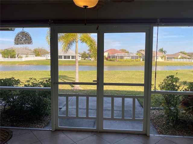 unfurnished sunroom with a water view