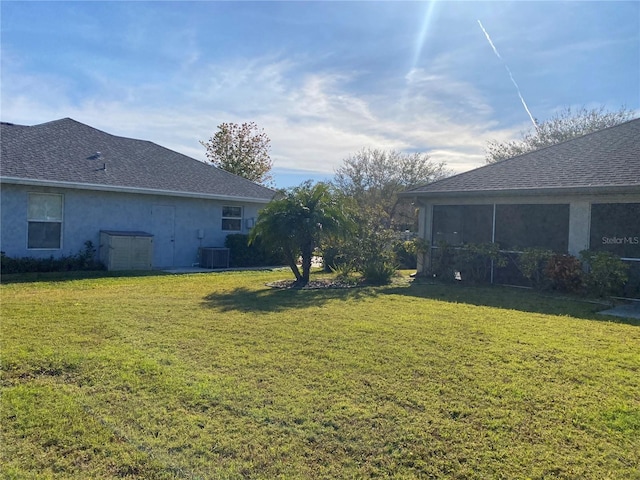 view of yard with a sunroom