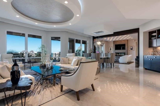 interior space featuring a chandelier, a tray ceiling, and light tile floors