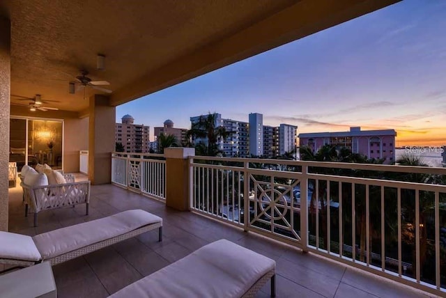 balcony at dusk with ceiling fan