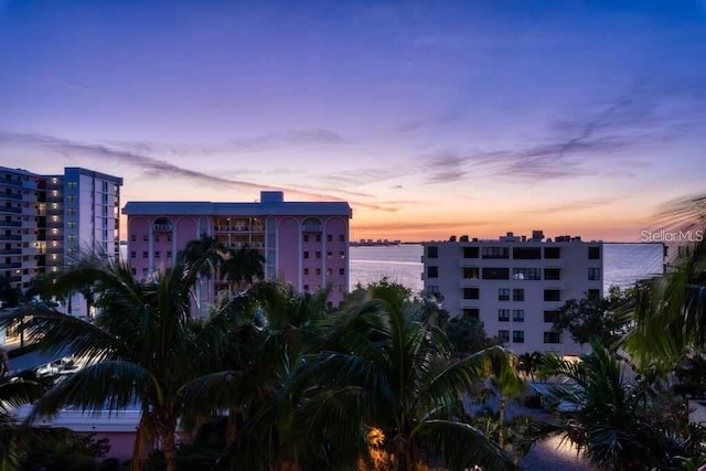 outdoor building at dusk featuring a water view