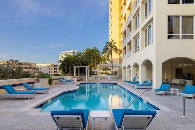 view of swimming pool with outdoor lounge area and a patio area