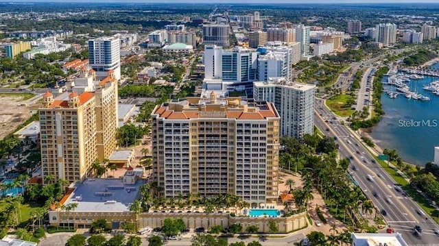 birds eye view of property with a water view