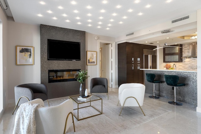 living room featuring visible vents, recessed lighting, and a fireplace