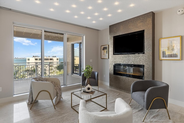 living room featuring light tile patterned floors, recessed lighting, a large fireplace, and baseboards