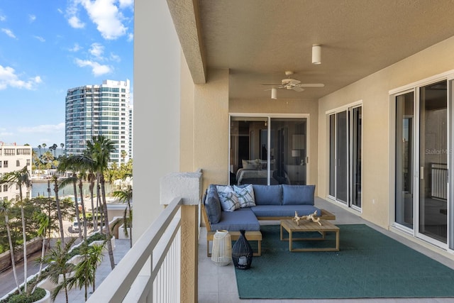 balcony featuring an outdoor hangout area and ceiling fan