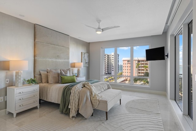 bedroom featuring baseboards and a ceiling fan