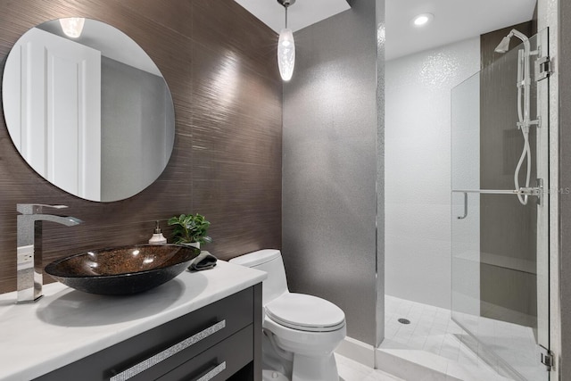 bathroom featuring vanity, decorative backsplash, a shower stall, tile walls, and toilet