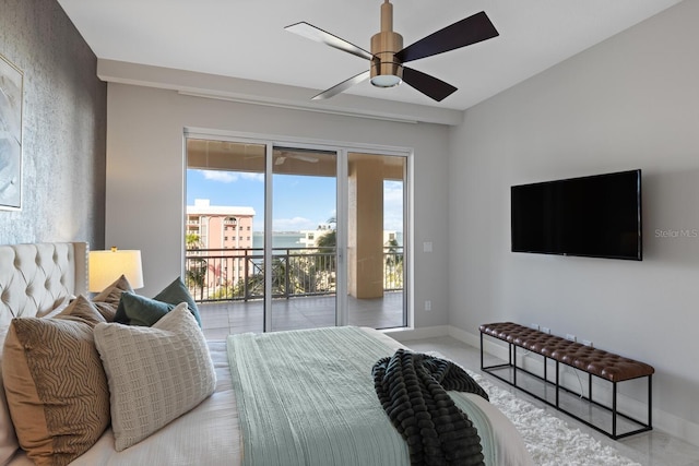 bedroom featuring a ceiling fan, baseboards, and access to outside