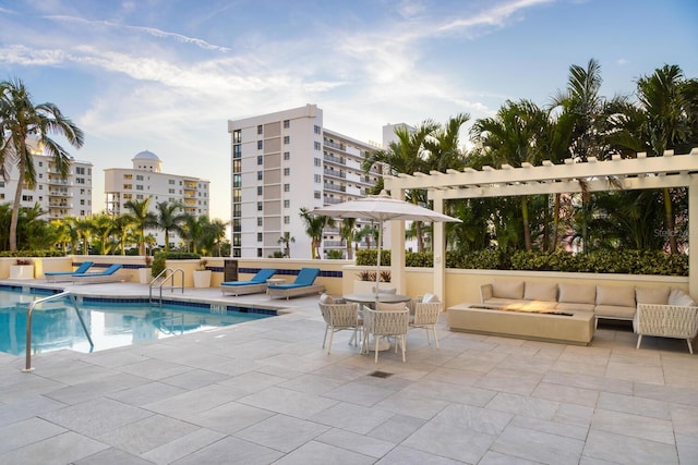 pool with a patio and an outdoor hangout area