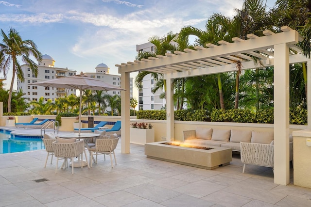 view of patio with a fenced in pool, an outdoor living space with a fire pit, and a pergola