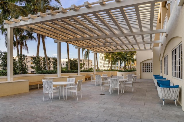 view of patio featuring outdoor dining area