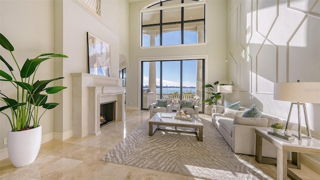 living room featuring a towering ceiling