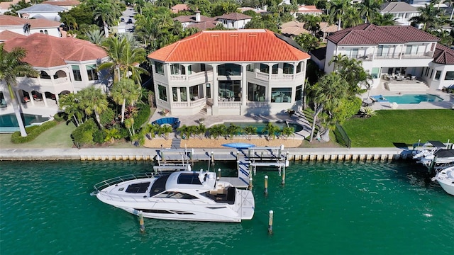 dock area with a patio and a water view