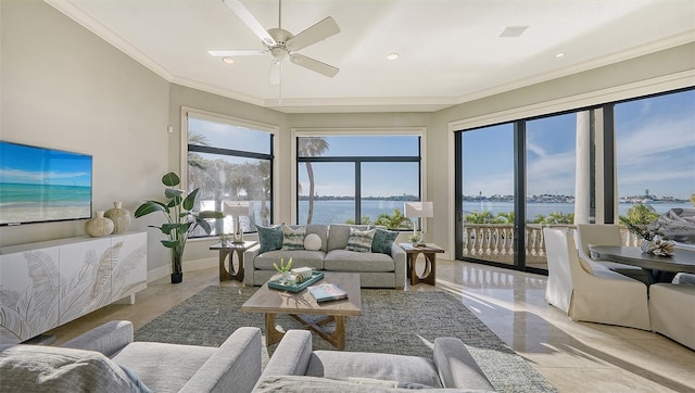 living room with ceiling fan, ornamental molding, and a water view