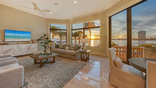 living room with ceiling fan, ornamental molding, and a water view