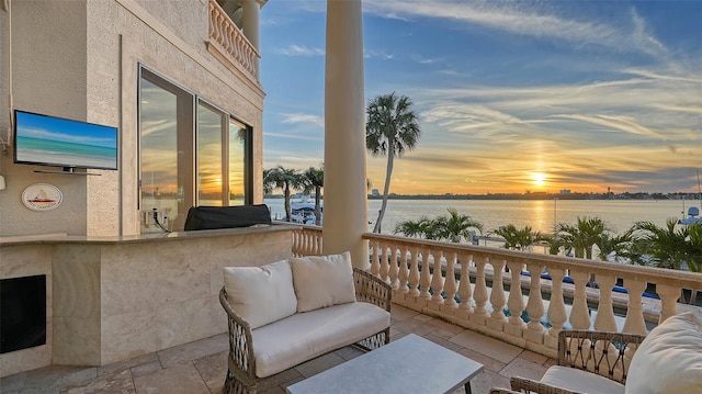 balcony at dusk with a water view