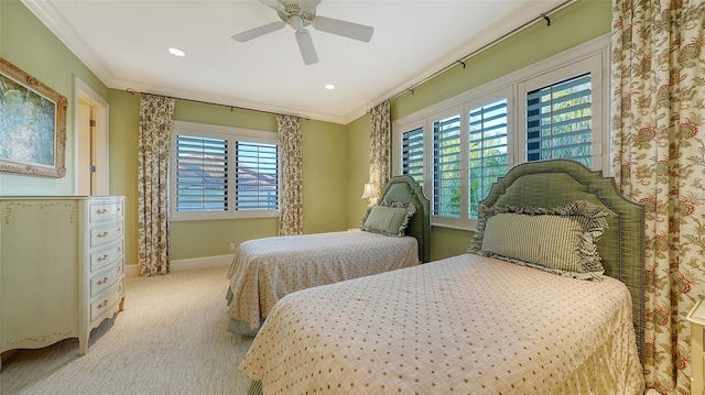 bedroom featuring multiple windows, crown molding, light carpet, and ceiling fan