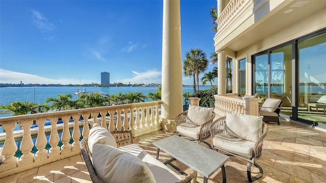 balcony featuring a water view