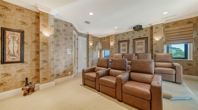 carpeted home theater with crown molding