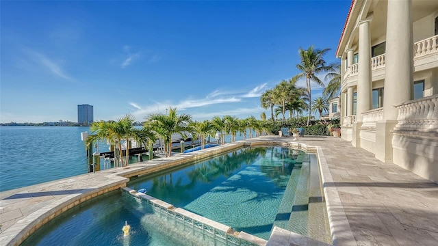 view of pool with a water view