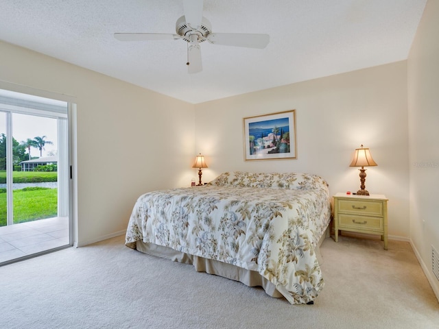 carpeted bedroom with access to exterior and ceiling fan