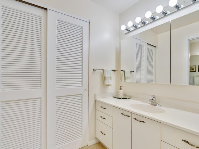 bathroom featuring vanity with extensive cabinet space