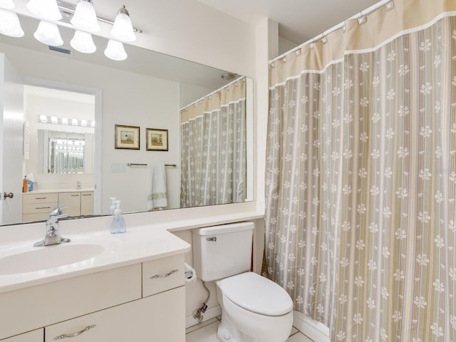 bathroom with toilet and vanity