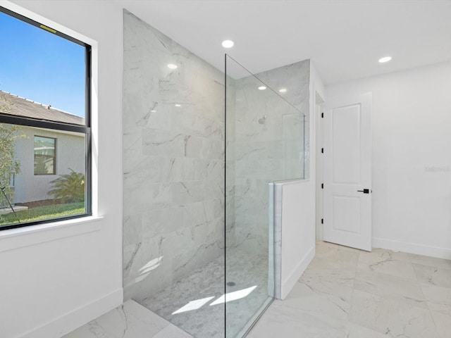 bathroom with a tile shower