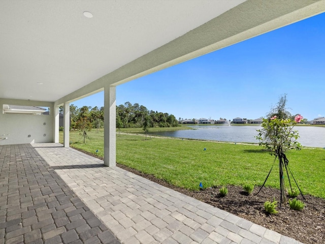 view of patio featuring a water view