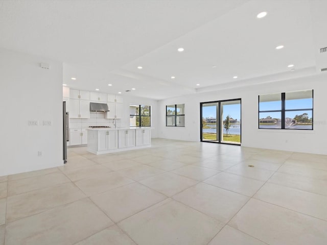 unfurnished living room with light tile patterned flooring