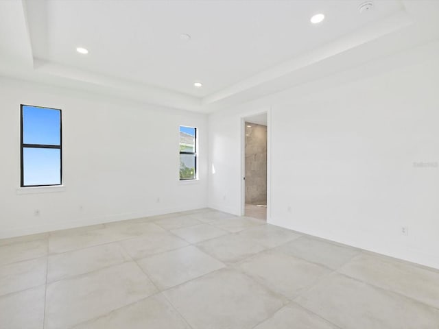 empty room with a tray ceiling