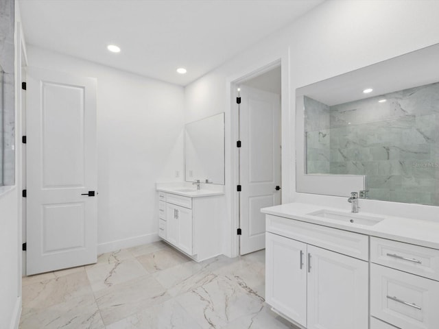 bathroom with vanity and tiled shower