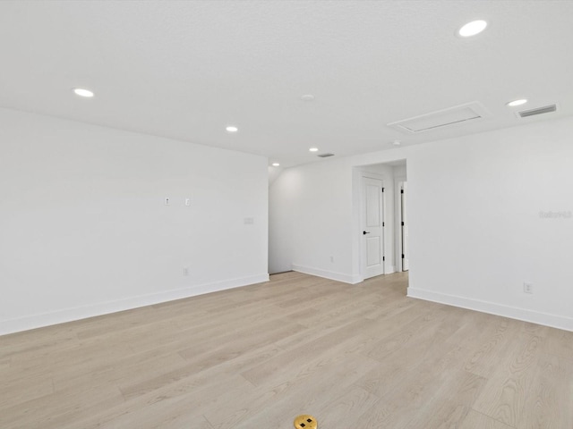 unfurnished room featuring light hardwood / wood-style floors