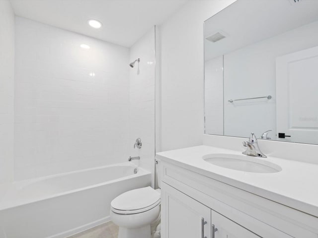 full bathroom with vanity, toilet, and tiled shower / bath combo