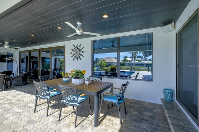 exterior space with an outdoor living space and ceiling fan