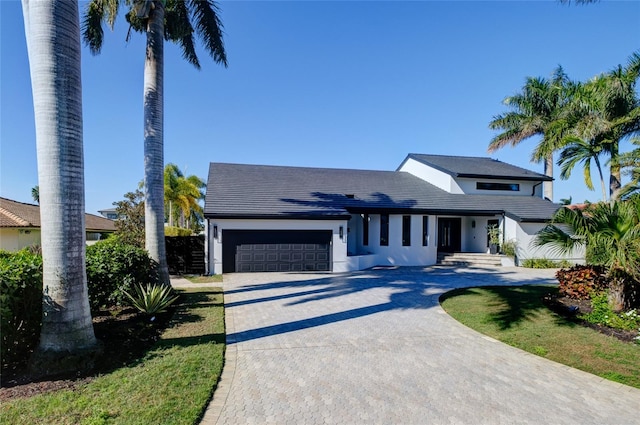 view of front of home with a garage