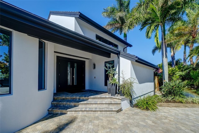 doorway to property with a patio